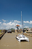Panama, Panama Canal, boats travelling through the Miraflores Locks.