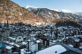 High Angle View Of Snow Covered Rooftops In The Town Of Zermatt; Zermatt Valais Switzerland