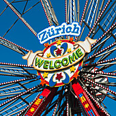 A Bright Colourful Sign Saying Zurich Welcome On A Ferris Wheel; Zurich Switzerland