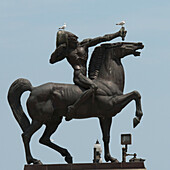 Birds Perched On An Equestrian Statue Against A Blue Sky; Chicago Illinois United States Of America