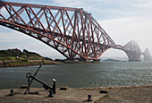 Forth Bridge Going Over The Water In The Fog; North Queensferry Scotland