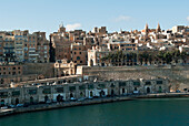 Many levels and sizes of buildings on hillside of Grand Harbor; Valetta, Malta