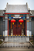 China, Front view of Chinese doorway with lanterns