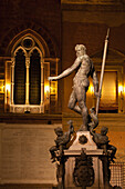 Italy, Emilia-Romagna, Bologna, Neptune fountain and Palazzo Re Enzo walls at night