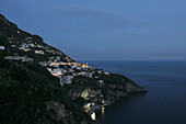 Italy, Salerno, Village along Amalfi coast at night; Positano