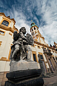 Czech Republic, Low angle view of statue and architecture; Prague