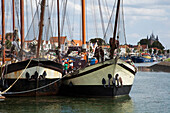 Netherlands, Zealand, Boats docked in a busy harbor; Zierikzee