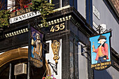 United Kingdom, Scotland, Low angle view of commercial signs of traditional pub on Lawnmarket; Edinburgh