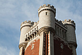 Close Up Of The Top Of A Castle Tower With Blue Sky And Clouds; Toronto, Ontario, Canada