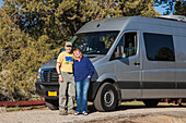 A Senior Couple Stand In Front Of Their Camper Van At The Bob Scott Forest Service Campground Near Ely; Nevada, United States Of America