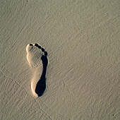 Fußabdruck im Strandsand