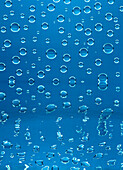 Waterdrops on Blue Background