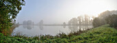 Landscape of Foggy Lake in Early Morning in Autumn, Bavaria, Germany