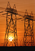 Silhouette of Transmission Towers At Sunset