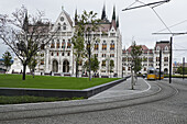 Tram by Hungarian Parliament Building on Rainy Day, Budapest, Hungary