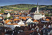 Overview of city and rooftops with St Vitus Church, Cesky Krumlov, Czech Republic.
