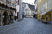 Cobblestone city street and historical buildings, Cesky Krumlov, Czech Replublic.