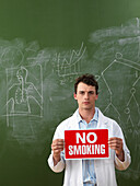 Scientist Holding No Smoking Sign