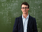 Teacher in Front of Blackboard