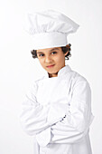 Junge als Koch verkleidet