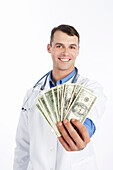Doctor Holding Cash