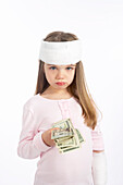 Girl With a Bandage on Her Head Holding Cash