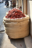 Burlap Sack of Dried Hot Chili Peppers at a Wholesaler's Shop, Kochi, Kerala, India