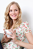 Woman Enjoying a Cup of Coffee