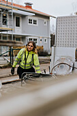 Young female road worker at work