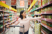 Woman doing shopping in supermarket