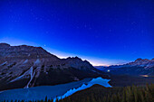 The stars of Ursa Major, the Great Bear, over the waters of Peyto Lake, Banff, in deep twilight. Arcturus in Böotes, the Bear Driver, is setting over the peak at left. Ursa Major contains the seven stars that make up the Big Dipper, aka the Plough or the Wagon. This was October 13, 2022 on a very clear night in the Rocky Mountains.