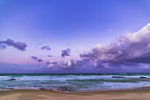 A study in twilight colours at sunset looking east opposite the Sun, with the dark shadow of the Earth, pink Belt of Venus and bright cumulous clouds by contrast. The location is Ulrich Beach at Nambucca Heads, NSW, Australia.