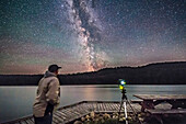 A selfie at Reesor Lake in Cypress Hills with the Milky Way, July 29, 2017, with the Canon 6D at ISO 6400 and 14mm Rokinon SP at f/2.5. The camera is shooting a panning time-lapse with the SYRP Genie Mini. A dark frame is included for demo purposes. The dark frame was taken immediately afterwards but is a single dark.