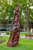 A sculpture of the Virgin Mary carved from a standing dead tree trunk in the Plaza San Martin in San Rafael, Argentina.
