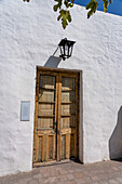 Antique carved wooden doorway in the Birthplace Museum of Domingo F. Sarmiento in San Juan, Argentina.