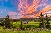 The Symons-Noble log cabin from the 1940s in Cypress Hills Interprovincial Park, on the Saskatchewan side, at sunset on July 9, 2014. This is a stack of 6 images for a high dynamic range composite to capture the bright sky and darker foreground in one image. Taken with the Canon 60Da and 10-22mm lens.