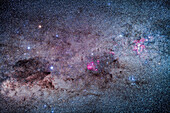 The amazing area of the southern Milky Way in Carina and Crux, the brightest part of the Milky Way after the galactic core region. At right is the Carina Nebula, with the Southern Pleiades cluster, IC 2602, below it. The Football Cluster, NGC 3532, is at upper left of the Carina Nebula. At centre is the region of Lambda Centauri, with the star cluster NGC 3766, the Pearl Cluster, above the emission nebulosity. At left is the Southern Cross, with the dark Coal Sack at bottom left of the Cross, with thin tendrils extending to the right. To the left of Alpha Cruxis at the bottom of the Cross is t
