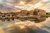 View of Archaeological Museum of Olbia and harbour boats on sunny day in Olbia, Olbia, Sardinia, Italy, Mediterranean, Europe