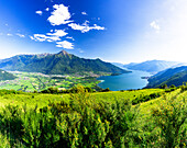 Panoramic of Monte Legnone and Alto Lario from green meadows above Lake Como, Bugiallo, Como province, Lombardy, Italian Lakes, Italy, Europe