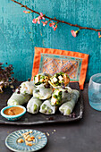 Lucky rice paper rolls with lettuce, cucumber, spring onions, peanuts (vegan)