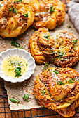 Pesto yeast knots with garlic butter