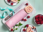 Biscuit roulade with marzipan and raspberries