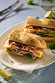 Baguette sandwich with ham, cheese and vegetables