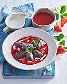 Sweet poppy seed gnocchi with strawberry sauce