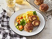 Small meatloaf 'Cordon Bleu' with ribbon noodles and vegetables