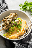 Marinated chicken skewers with mashed potatoes
