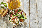 Summer salad with turkey breast, beans and apple