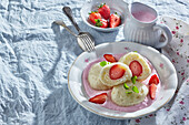 Strawberry dumplings with strawberry sauce