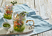 Vegetable salad in a glass with mint-avocado dip