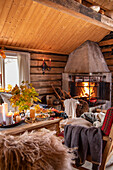 Rustic living room with fireplace and autumnal decorations